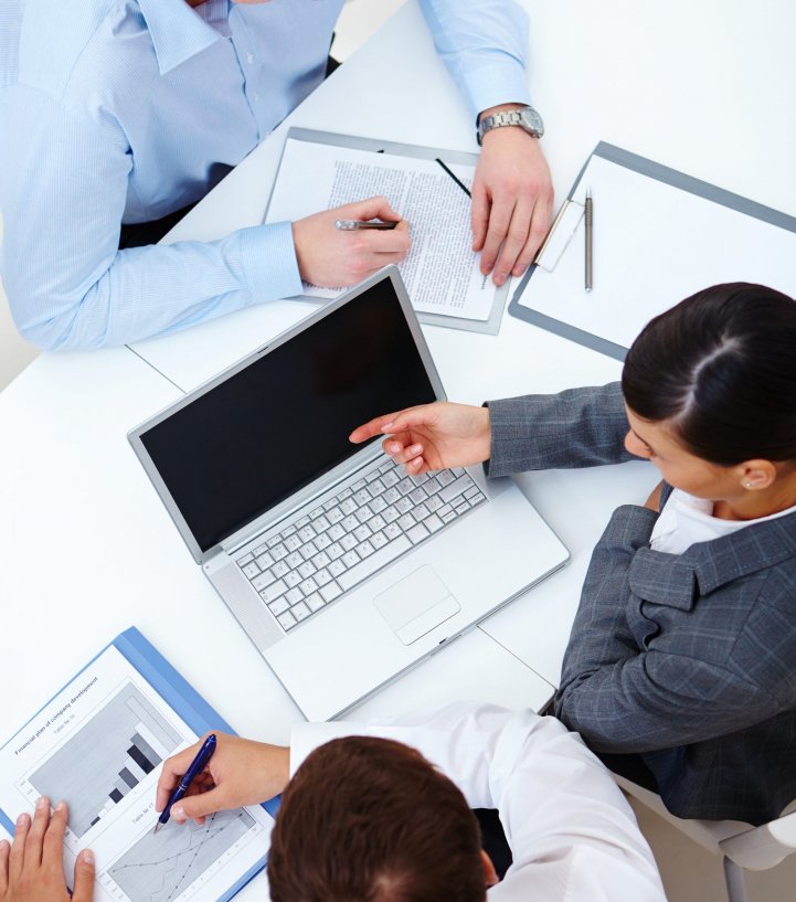 Above view of business partners working at meeting